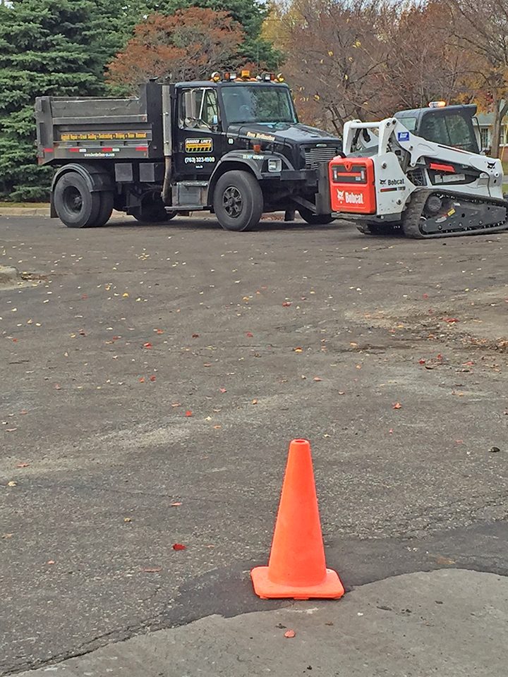 Aged church parking lot pavement before removal