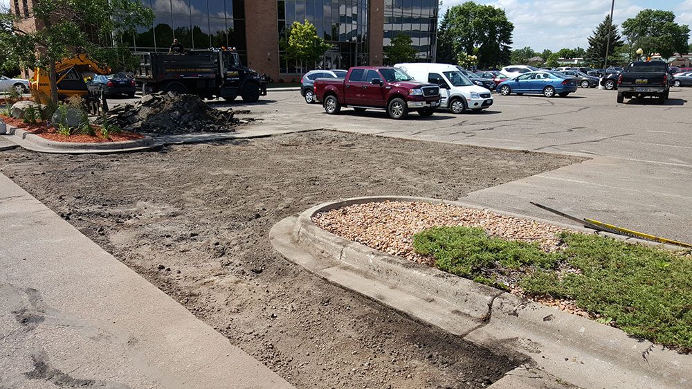 Parking lot section removed down to base before paving